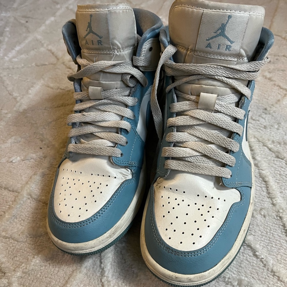 University blue Women’s Nike high top Jordans.